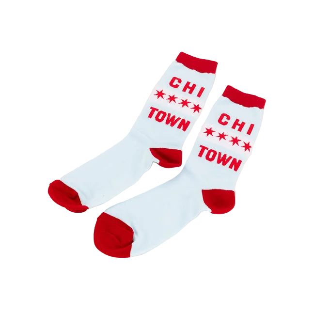 A pair of white crew socks with red heels, toes, and cuffs, featuring the red text 'CHI TOWN' and red stars printed on the sides, displayed on a clean white background.