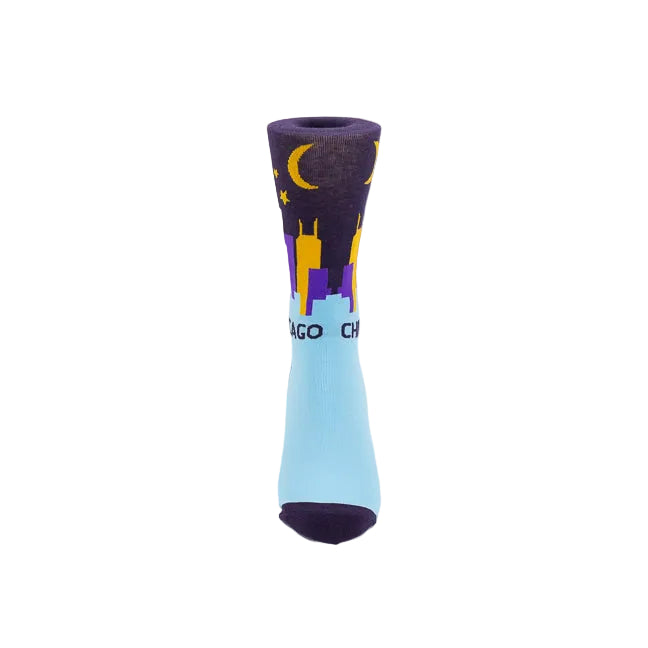 A single crew sock with a Chicago skyline design, featuring a light blue lower half, a dark purple upper half with a yellow crescent moon and stars, and purple and yellow building silhouettes, on a white background.
