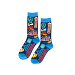 A pair of socks with a vibrant Chicago-themed graphic print on a white background. The socks feature a dark blue base with illustrations of Chicago icons like the skyline, a Ferris wheel, a marquee, a 'CHICAGO' sign, pizza slices, and Route 66 shields, with bright blue cuffs and toes.