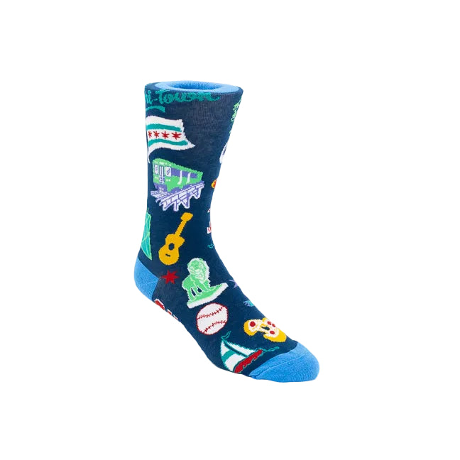 A single crew sock on a clean white background, featuring a dark navy blue base with colorful Chicago-themed graphics including the Chicago city flag, a green train, a yellow guitar, a green statue, a baseball, and a pizza slice.