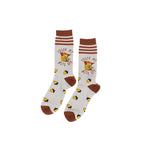 A pair of grey and brown tall socks featuring a shivering squirrel, scattered acorns and text "Froze My Nuts Off" against a white background.