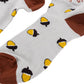 A pair of grey and brown tall socks featuring scattered acorns against a white background.