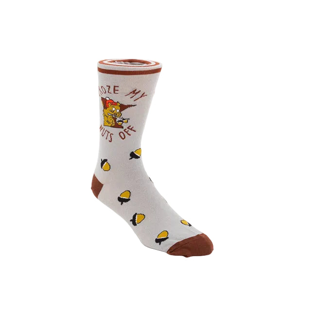 A single crew sock on a white background, featuring a light gray base with brown cuffs, heels, and toes, yellow acorn motifs, and a cartoon graphic with the text 'FROZE MY NUTS OFF'.