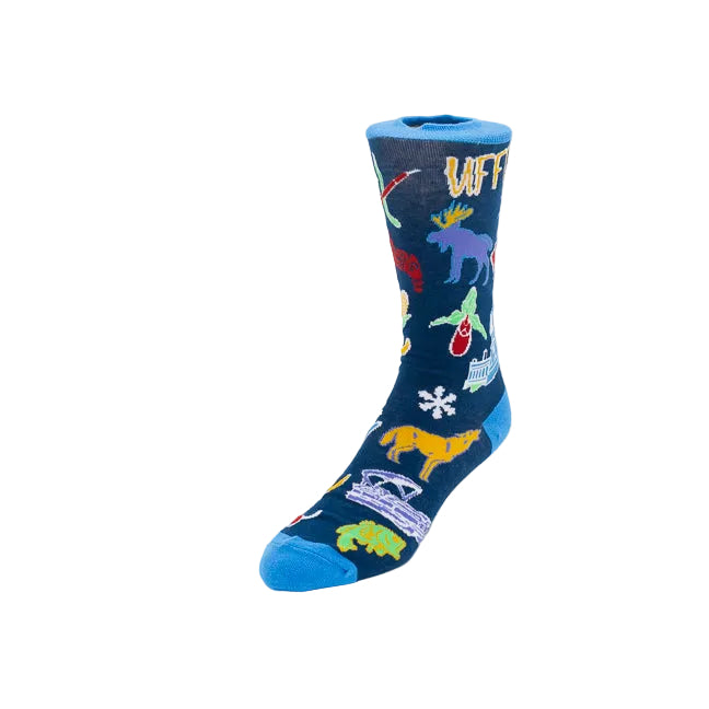 A single crew sock on a light gray background, featuring a dark blue base with colorful Minnesotan icons including a viking hat, a flag, a snowflake, hockey gear, a star, a snowflake and more. 