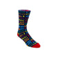 A single crew sock with a colorful all-over text pattern on a dark background, featuring a bright red toe and heel, photographed on a clean white studio background.