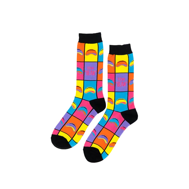 A pair of crew socks with a vibrant multicolor grid pattern featuring rainbow arches and the text 'THE BEAN' in pink, displayed on a clean white background.