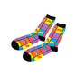 A pair of crew socks with a vibrant multicolor grid pattern featuring rainbow arches and the text 'THE BEAN' in pink, displayed on a clean white background.