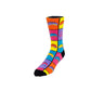 A single crew sock with a vibrant multicolor geometric pattern of yellow, pink, blue, purple, and orange blocks, featuring the text 'the BEAN' on the side, set against a plain white background. 