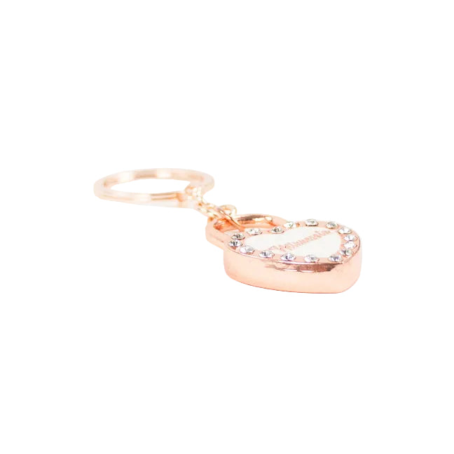 A rose gold heart-shaped keychain with a rhinestone-embellished border and a small engraved brand name on the heart, attached to a matching rose gold split key ring, set against a plain white background.