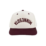 A structured baseball cap with an off-white crown and a dark maroon flat brim. The front of the crown features the word 'MINNESOTA' backwards and upside down embroidered in arched maroon lettering.
