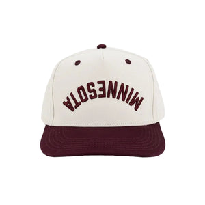 A structured baseball cap with an off-white crown and a dark maroon flat brim. The front of the crown features the word 'MINNESOTA' backwards and upside down embroidered in arched maroon lettering.