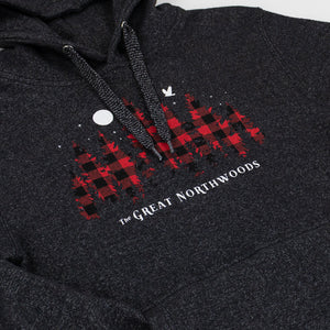 Close-up of a dark heather gray hoodie featuring a red and black buffalo plaid graphic with white text reading 'The Great Northwoods' and a small white bird logo.