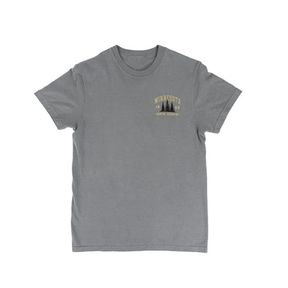 A heather gray short-sleeve crewneck t-shirt with a small yellow and black graphic on the left chest reading 'MINNESOTA 1858 NORTH COUNTRY -' above pine trees, displayed flat against a white background.