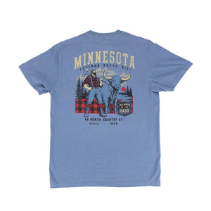 A heather blue short-sleeve t-shirt shown from the back, featuring a large graphic print of Paul Bunyan, Babe the Blue Ox, and the text 'MINNESOTA LEGENDS NEVER DIE' on a white background.