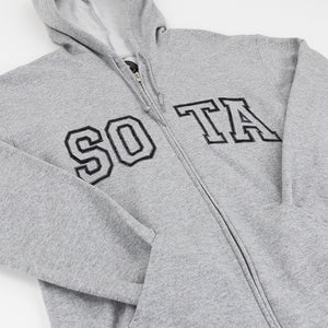 A close-up of a sport gray zip-up hoodie with 'SOTA' embroidered in black varsity-style block letters across the chest, shown on a plain white background.