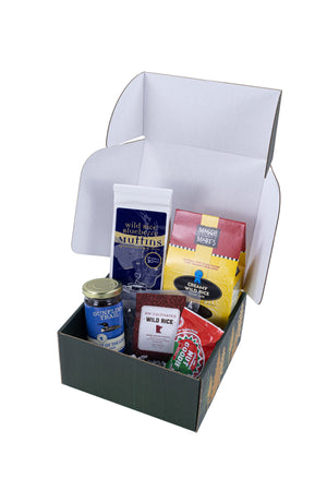 A Minnesota-themed gift box open and featuring an assorted of Minnesota foods and treats.