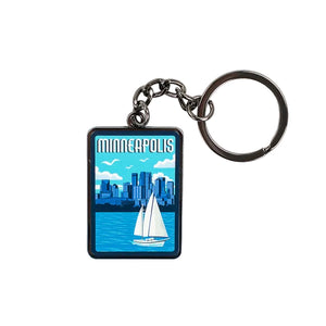 Keychain with Minneapolis skyline and sailboat design on a blue background