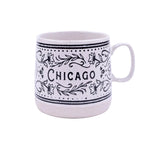 White mug with black floral patterns and 'Chicago' text on a white background