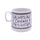 White mug with black floral patterns and 'Chicago' text on a white background