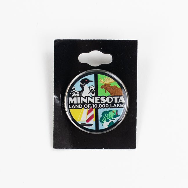 Minnesota-themed button pin on a black card with a white background