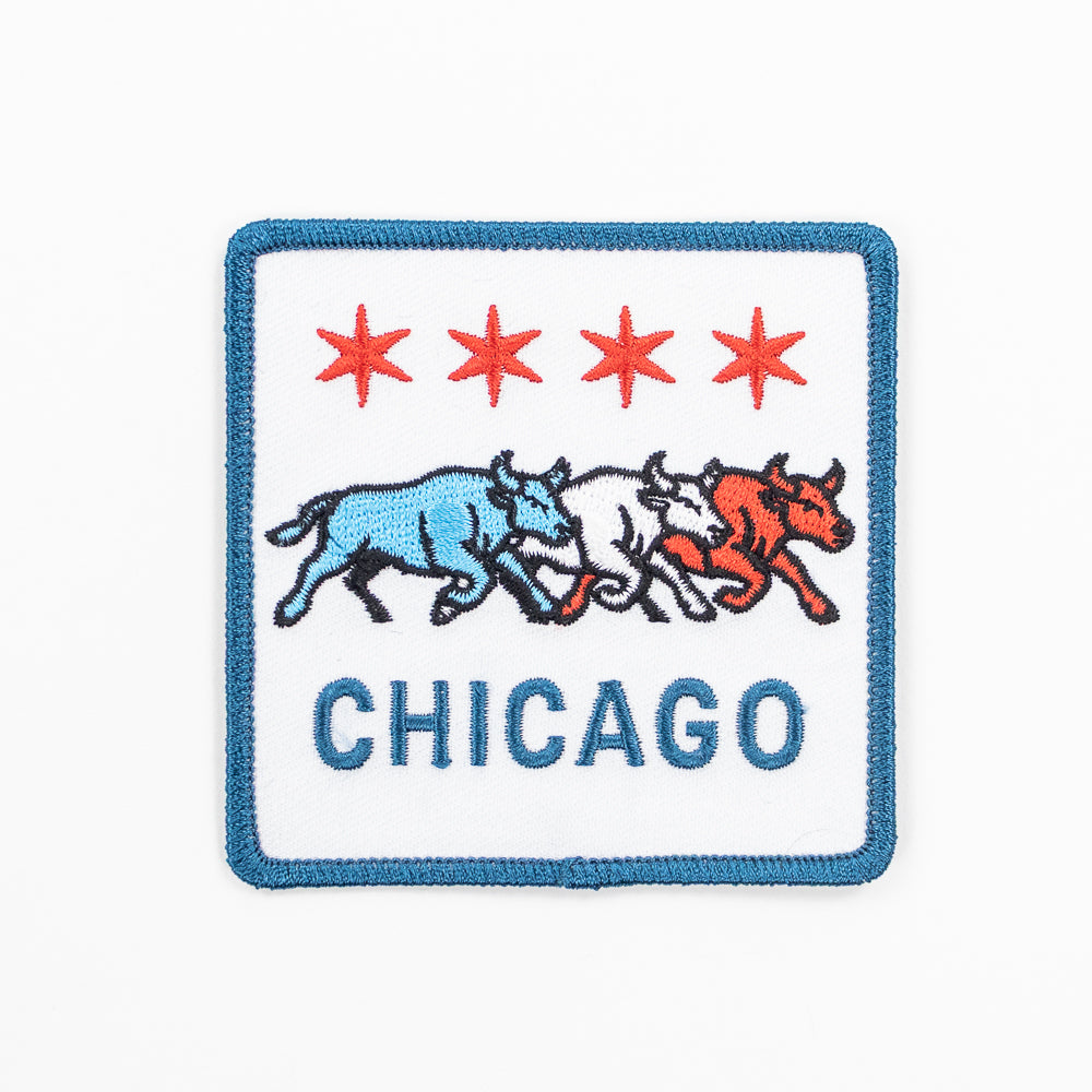 Embroidered patch with Chicago logo featuring three bulls and four red stars on a white background.
