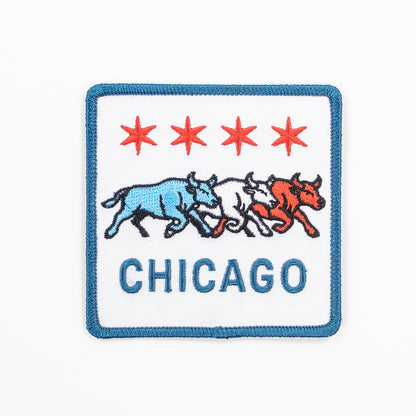 Embroidered patch with Chicago logo featuring three bulls and four red stars on a white background.