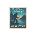 Patch with a silhouette of Bigfoot fishing, text 'Don't Stop Believing! Minnesota', and a state outline on a white background.