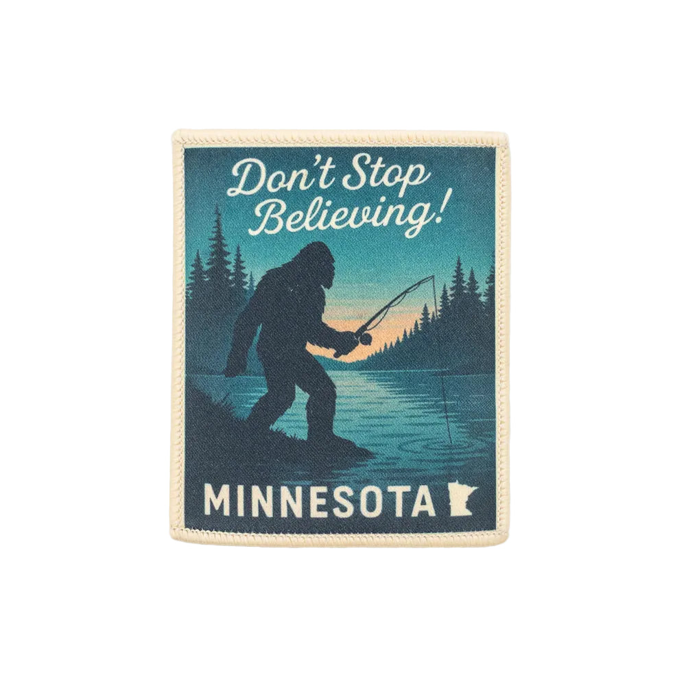 Patch with a silhouette of Bigfoot fishing, text 'Don't Stop Believing! Minnesota', and a state outline on a white background.