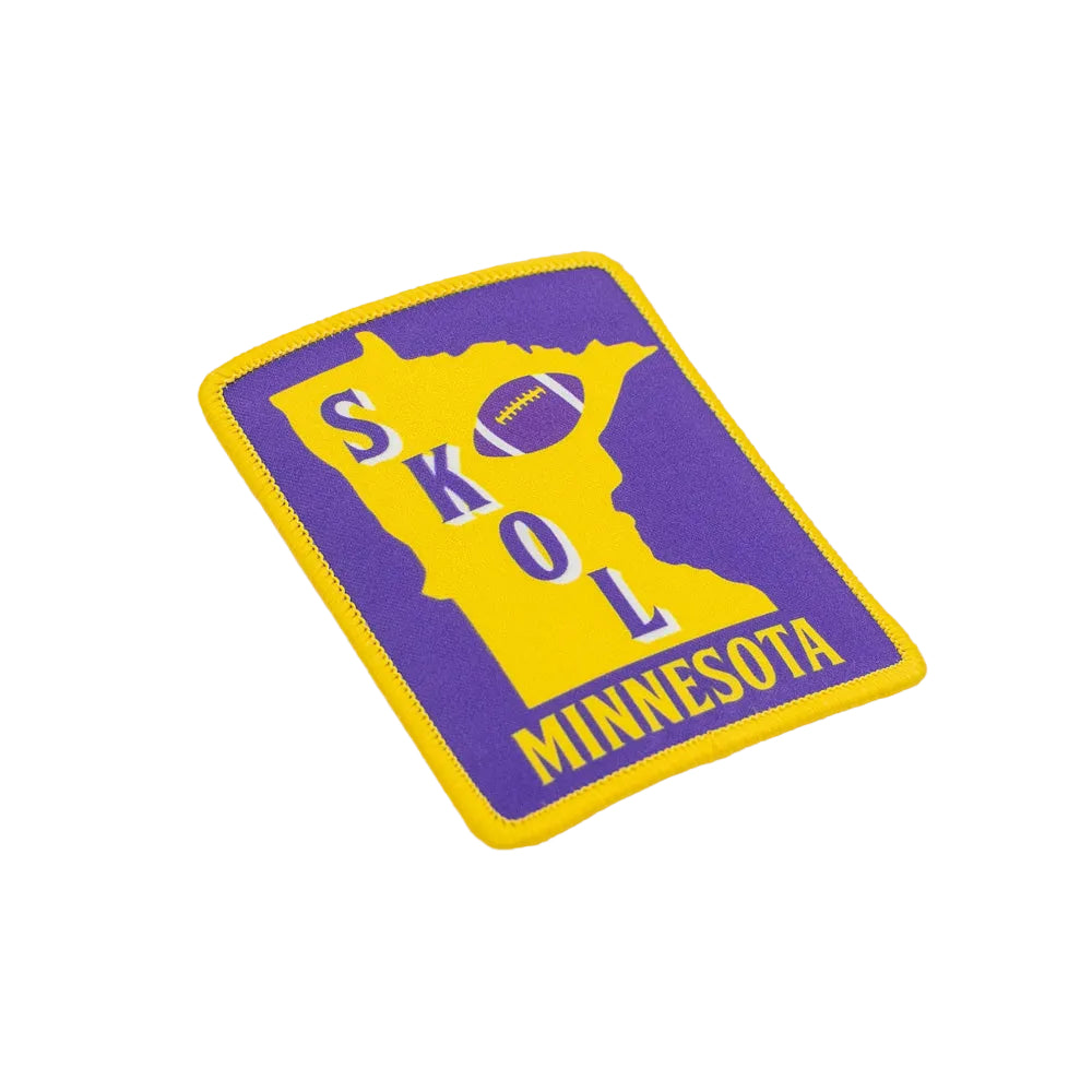 Purple and yellow patch with 'Skol Minnesota' text on a white background