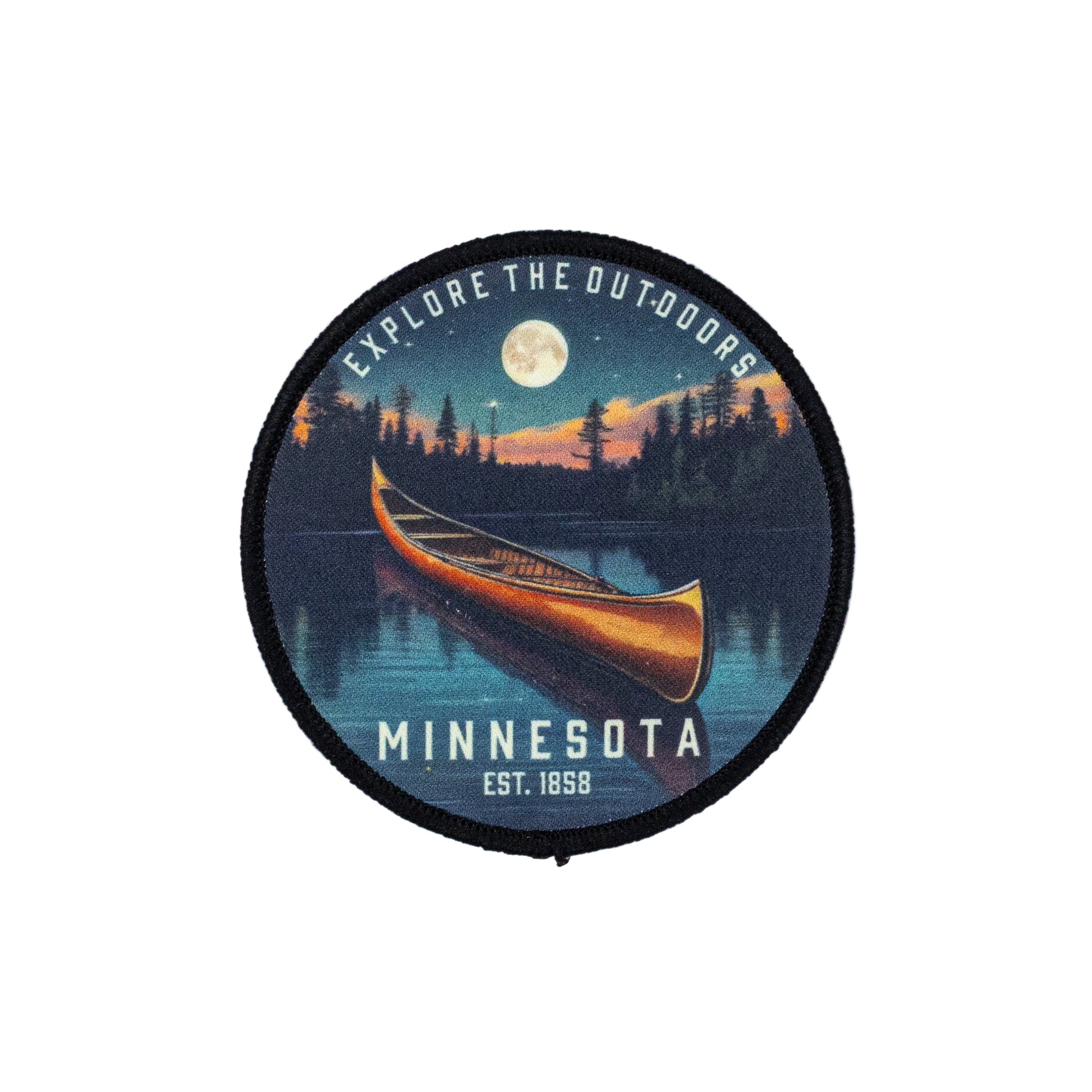 Round patch with a canoe design and 'Explore the Outdoors Minnesota Est. 1858' text set against a white background