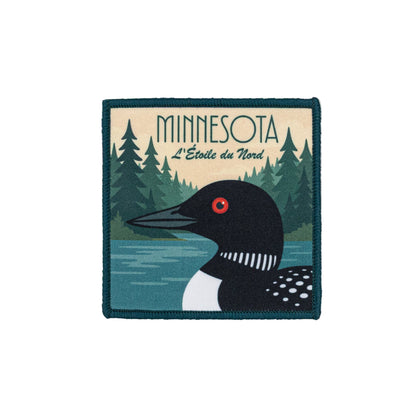 Patch with a loon and forest design, featuring the word 'Minnesota'.