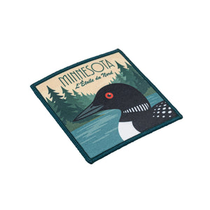 Patch with loon design and 'Minnesota' text on a white background
