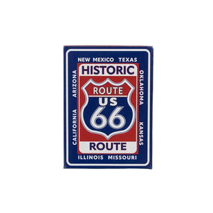 A deck of cards with a red, white and blue Route 66 design against a white backdrop.