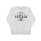Grey sweatshirt with a Chicago design on the front against a white background.