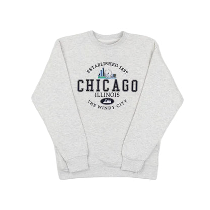 Grey sweatshirt with a Chicago design on the front against a white background.