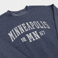Blue sweatshirt with 'Minneapolis 1867' text on a white background