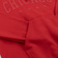 Close-up of a red hoodie with 'Chicago' text and star designs.