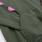 Close up of a green sweatshirt, the sleeve inside a front pocket.