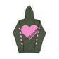 A military green hooded sweatshirt with a large pink heart and text CHICAGO on the back, pink hearts running down each sleeve, set against a white background