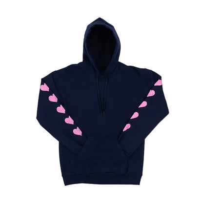 A Navy Blue hooded sweatshirt with pink hearts running down the sleeves, set against a white background.