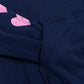 Close up of a sleeve inside a front pocket of a navy blue sweatshirt.