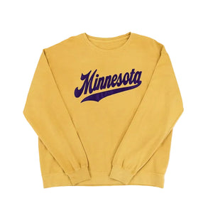 A mustard yellow sweatshirt with Minnesota and an athletic swoosh underneath, set against a white background.