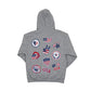 Gray hoodie with various USA-themed patches on the back on a white background