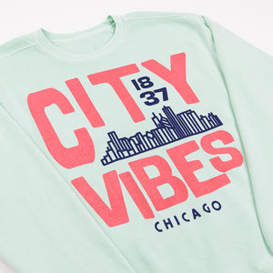 Mint Green sweatshirt with pink text 'CITY VIBES 1837 CHICAGO' and a city skyline design on a white background