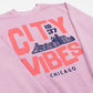 Pink sweatshirt with pink text 'CITY VIBES 1837 CHICAGO' and a city skyline design on a white background