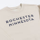 Beige sweatshirt with 'Rochester Minnesota' text on a white background