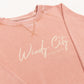 Pink sweatshirt with 'Windy City Chicago' text on a white background
