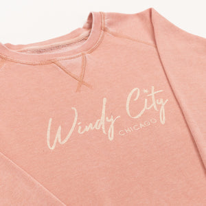 Pink sweatshirt with 'Windy City Chicago' text on a white background