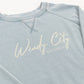 Light blue sweatshirt with 'Windy City Chicago' text on a white background