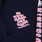 Navy hoodie with pink text and daisy graphic, featuring 'Do What Makes You Happy Minnesota' text on a navy background.